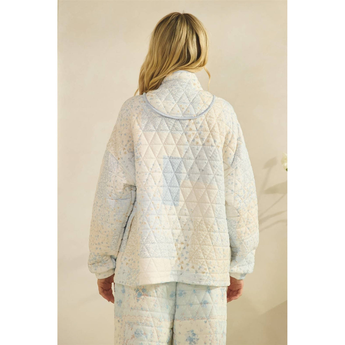 Floral textured quarter zip top