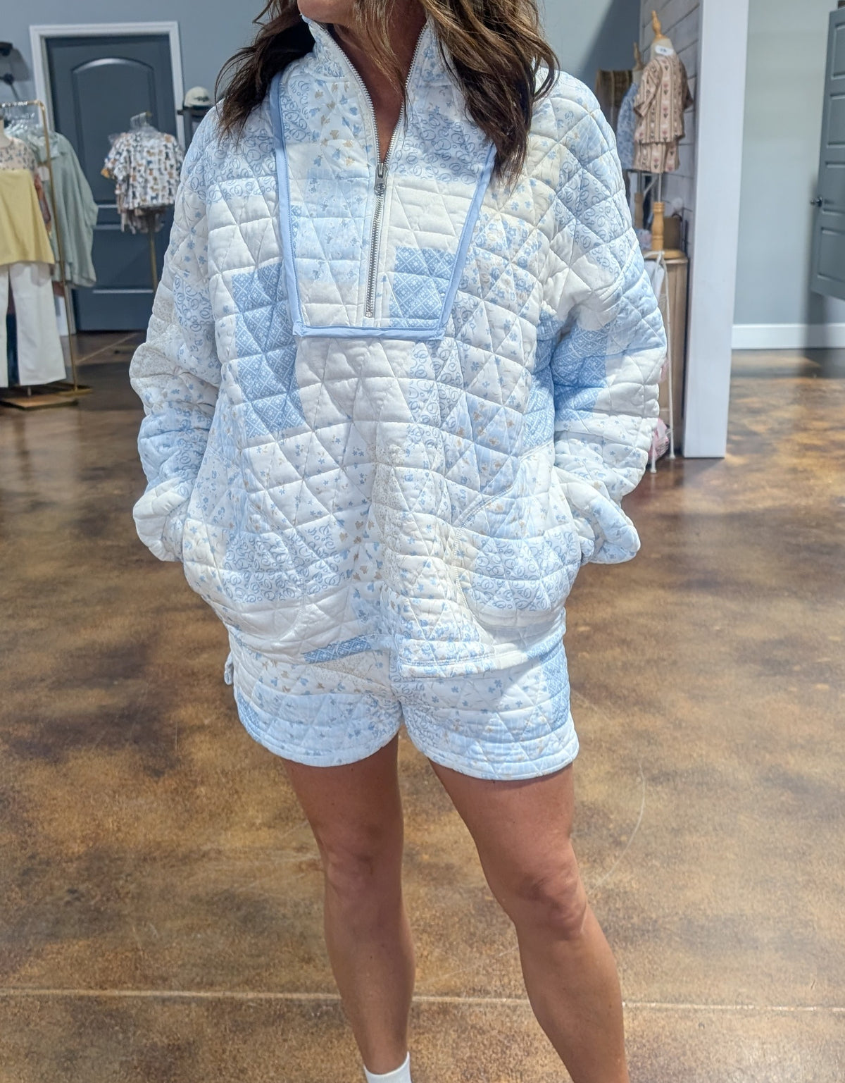 Floral textured quarter zip top